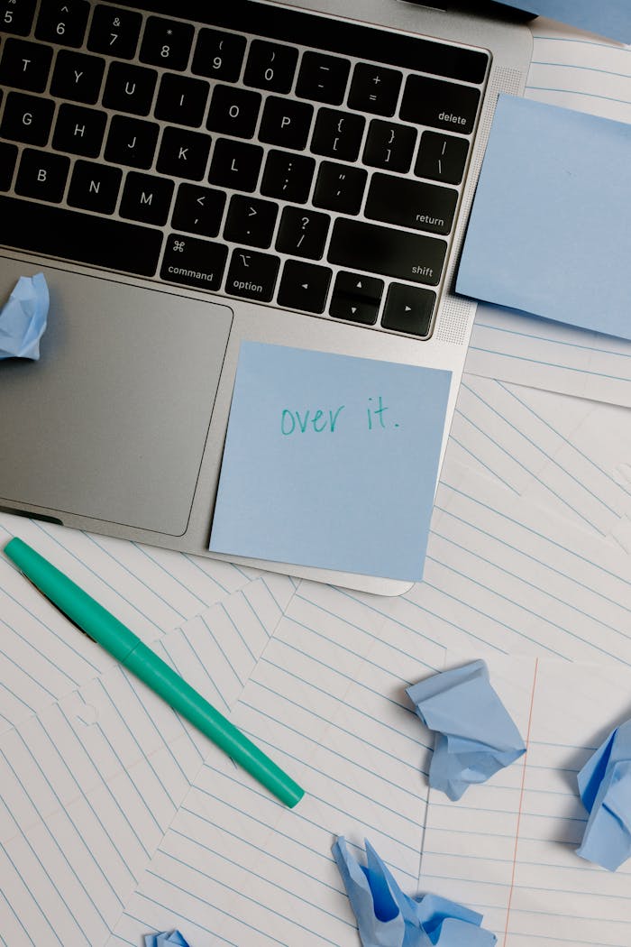 Teal Pen Beside White Paper